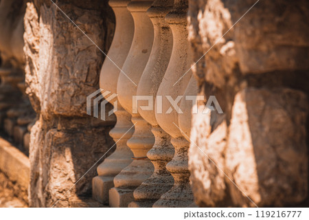 Krk Croatia Concrete fence balusters in the yard, selective focus Krk Croatia Concrete fence balusters in the yard, selective focus 119216777