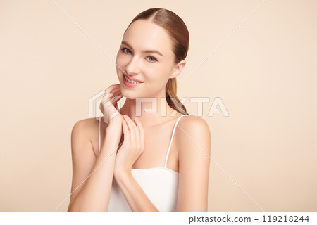 Beautiful young woman with clean fresh skin on beige background, Face care, Facial treatment, Cosmetology, beauty and spa, women portrait. 119218244