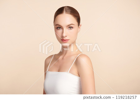 Beautiful young woman with clean fresh skin on beige background, Face care, Facial treatment, Cosmetology, beauty and spa, women portrait. 119218257