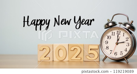 New Year 2025 celebration concept with midnight clock and year number on wooden blocks against blue background, festive greeting card design for holiday event 119219089