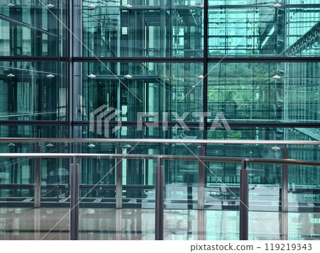 A modern tall building that features a significant amount of glass 119219343