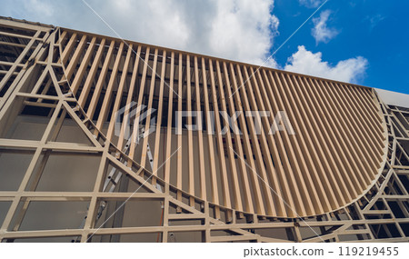 A structure featuring wooden slats on construction site contributing to its architectural style A structure featuring wooden slats on construction site contributing to its architectural style 119219455