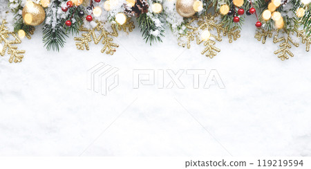 Christmas decorations scattered throughout the snow on a white background 119219594