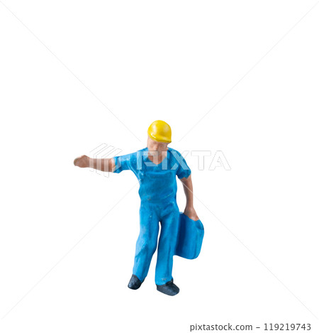 Miniature construction worker in a blue uniform isolate on white background with clipping path Miniature construction worker in a blue uniform isolate on white background with clipping path 119219743