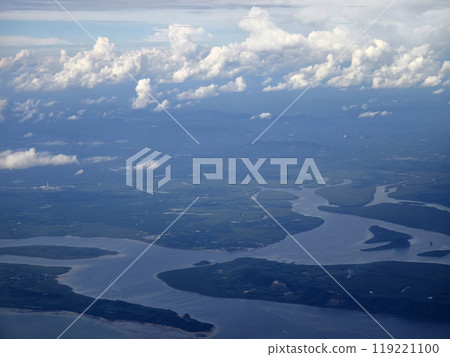 A breathtaking view of the vast ocean as seen from an airplane window 119221100