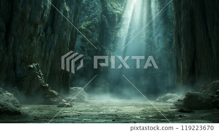 Dramatic cave with towering rock walls and sunlight streaming through 119223670