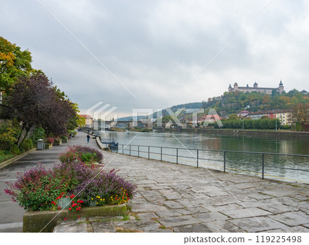 Wuerzburg, Germany - Oktober 19th 2023: View along the walking promenade over the Main river. 119225498