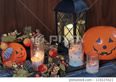Happy Halloween. Holiday composition with pumpkins and candles. Background for design.  119225621