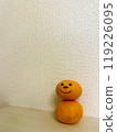 Tangerines with faces drawn on them 119226095