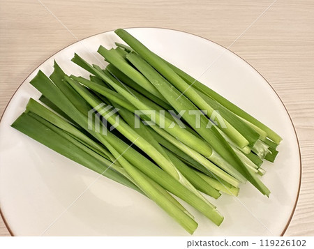 Sliced chives on a plate Sliced chives on a plate 119226102