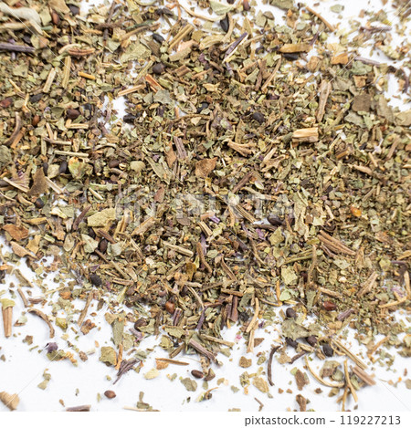 Dry basil spice seasoning macro texture on white background. Dry basil spice seasoning macro texture on white background. 119227213