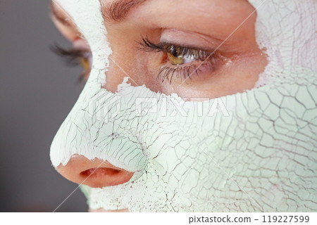 Girl with mud mask on face Girl with mud mask on face 119227599