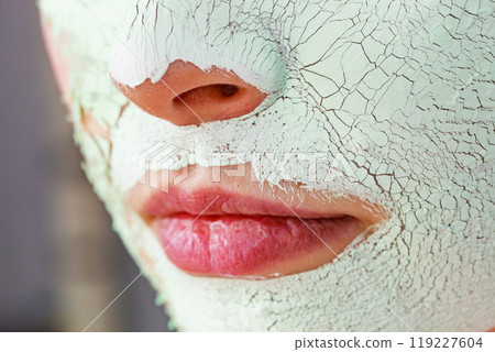 Girl with mud mask on face 119227604