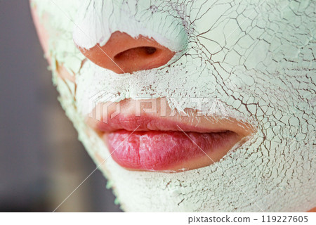 Girl with mud mask on face 119227605