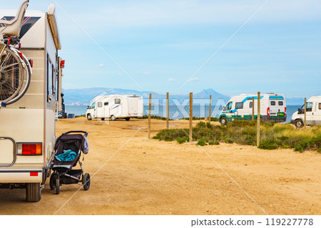 Baby stroller at caravan outdoors on beach. Baby stroller at caravan outdoors on beach. 119227778