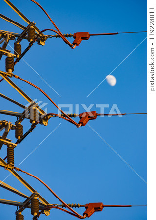 High voltage towers against blue sky High voltage towers against blue sky 119228011