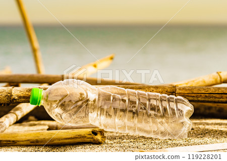 Plastic empty water bottle abandoned on nature 119228201