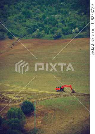 Digger excavator on field. 119228229
