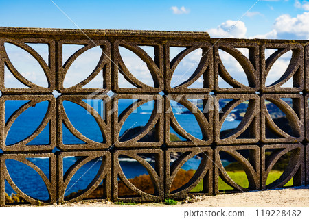 Concrete fence before sea. Coast at Cabo de Penas Asturias Spain 119228482