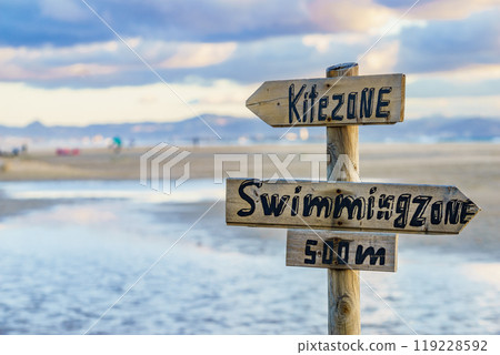 Kitezone and swimmingzone sign at beach. 119228592