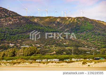 Camper vehicles on beach, Spain 119228595