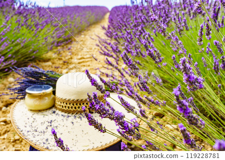 Summer hat and jar with honey at lavender field. Holidays in France. Summer hat and jar with honey at lavender field. Holidays in France. 119228781