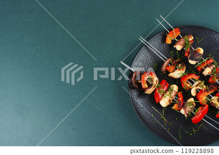 Octopus skewers grilled. 119228898