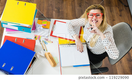 Happy business woman in office Happy business woman in office 119229090