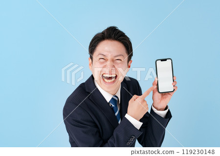 Businessman laughing with a smartphone Businessman laughing with a smartphone 119230148