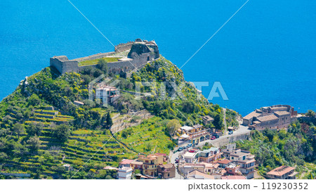 Taormina Castle and little church of Madonna della Rocca on green mount on Sicily island, Italy. 119230352