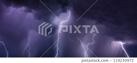Huge lightnings and heavy rain in dark stormy sky Huge lightnings and heavy rain in dark stormy sky 119230972