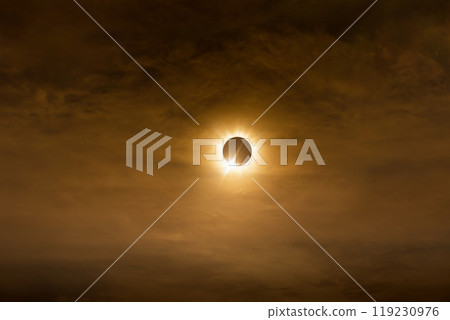 Total solar eclipse in dark red cloudy sky 119230976