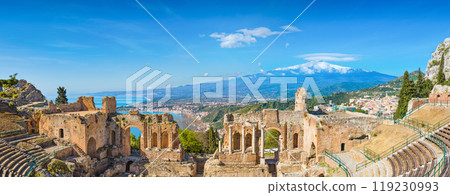 Ancient Greek theatre in Taormina on background of Etna Volcano, Italy 119230993