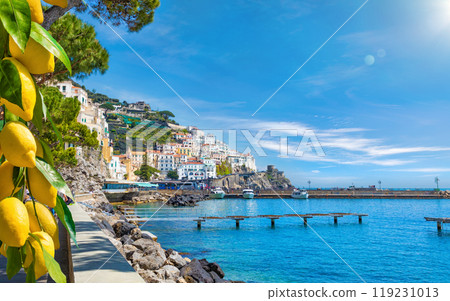 Beautiful Amalfi on hills leading down to coast, comfortable beaches and azure sea on Amalfi Coast in Campania, Italy 119231013