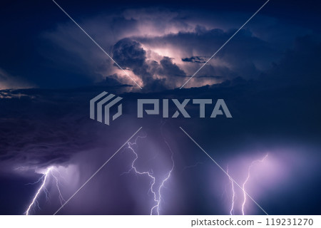 Huge lightnings and heavy rain in dark stormy sky 119231270