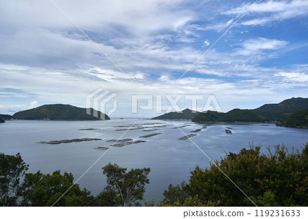 A landscape of the Uwa Sea with scenic islands, fish farming rafts, and ria coastline. Uwajima City, Ehime Prefecture. A landscape of the Uwa Sea with scenic islands, fish farming rafts, and ria coastline. Uwajima City, Ehime Prefecture. 119231633