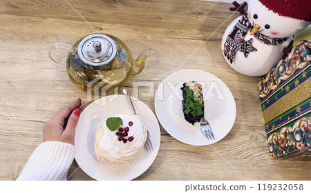 cakes and tea on the windowsill, Christmas decor 119232058