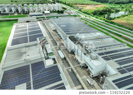 Solar energy for factory and warehouse building. Solar panels on roof of industrial plant. Commercial solar power. Rooftop solar power. Rooftop renewable energy system. Sustainable green energy. 119232220