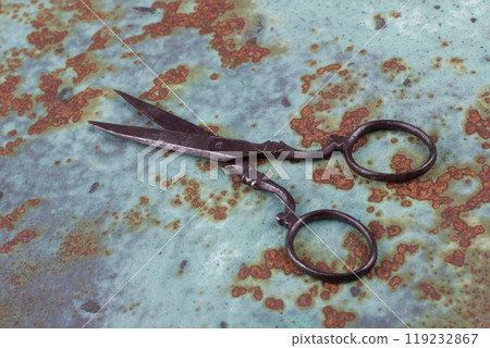 Vintage scissors on rusty background Vintage scissors on rusty background 119232867