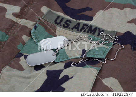 US ARMY branch tape and dog tags on woodland camouflage uniform US ARMY branch tape and dog tags on woodland camouflage uniform 119232877