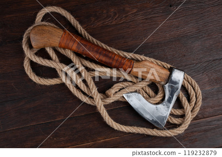 axe on wooden table 119232879