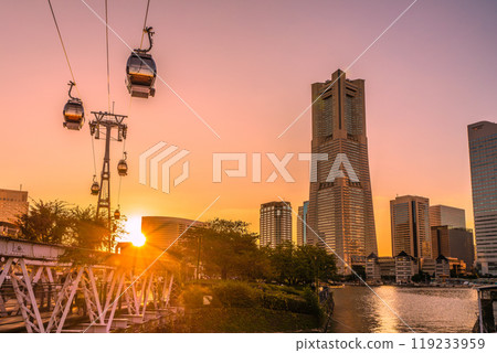 Yokohama cityscape in Japan in October. View of Yokohama Landmark Tower, the sunset, a houseboat, and the Minato Mirai area on the 13th Yokohama cityscape in Japan in October. View of Yokohama Landmark Tower, the sunset, a houseboat, and the Minato Mirai area on the 13th 119233959