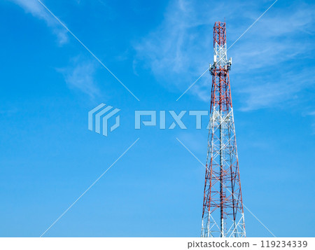 A telecommunications tower with various forms of antennas installed on its body, High antenna tower pillar of cellular communication on the blue sky background. A telecommunications tower with various forms of antennas installed on its body, High antenna tower pillar of cellular communication on the blue sky background. 119234339