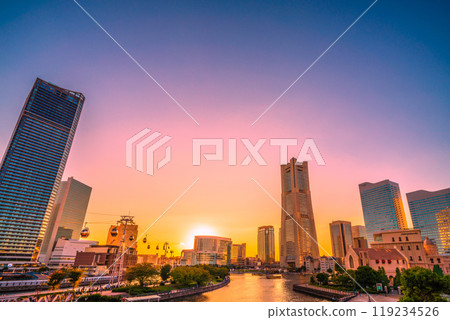 Yokohama cityscape in Japan in October. View of Yokohama Landmark Tower, the sunset, a houseboat, and the Minato Mirai area on the 13th Yokohama cityscape in Japan in October. View of Yokohama Landmark Tower, the sunset, a houseboat, and the Minato Mirai area on the 13th 119234526