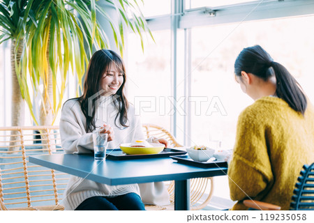 A woman dining at a restaurant 119235058