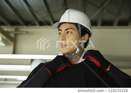 Workers dismantling steel beams 119235326