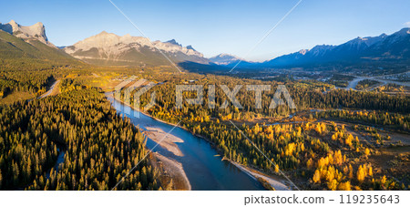 Aerial view of Canadian Rockies mountain range and Bow river forest in autumn morning. Canmore, Alberta, Canada. Mount Rundle. Aerial view of Canadian Rockies mountain range and Bow river forest in autumn morning. Canmore, Alberta, Canada. Mount Rundle. 119235643