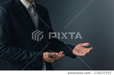 Portrait of businessman in suit standing thoughtful, half body and not showing face. Show off your work presentation. 119237355