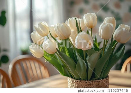 Bouquet of white tulips bringing springtime inside on dining table 119237446