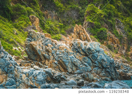 Natural background panorama edged shabby sea cliff mountain island. Gray brown stone rock texture vivid colour photo. Concept of geology, tourism after pandemic, fascination attraction power in nature 119238348
